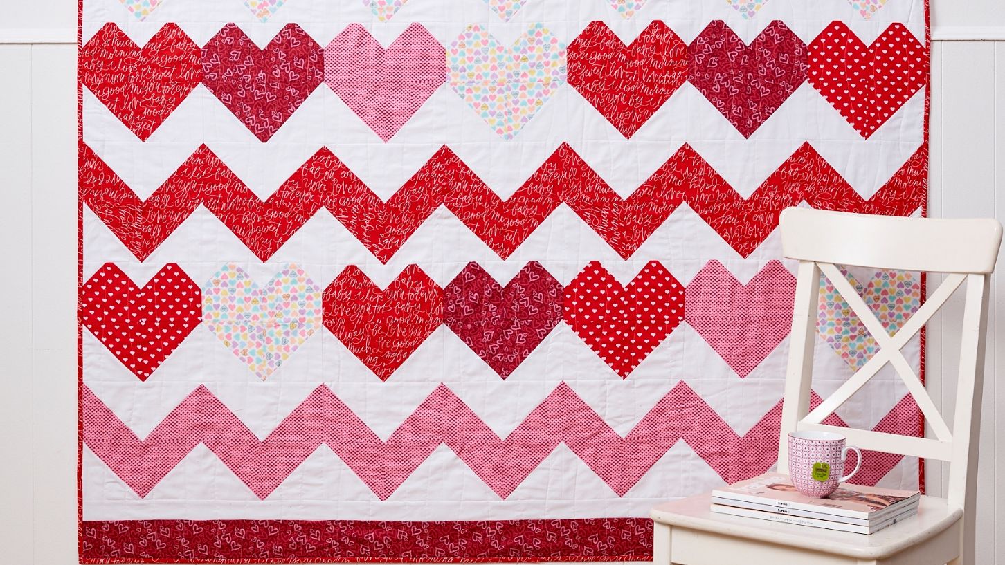 Red and white heart patterned quilt design