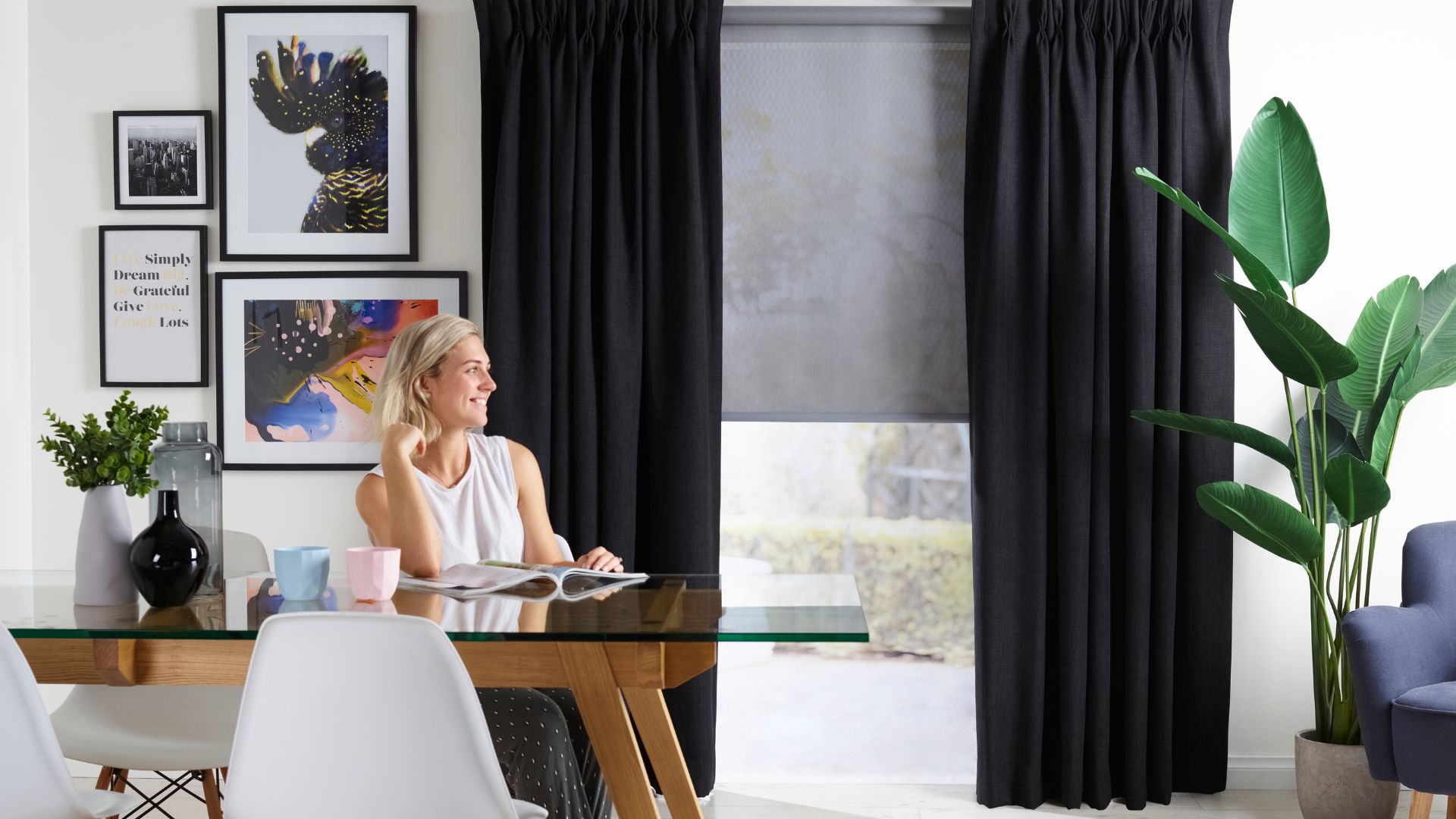 Layer your windows with a functional yet stylish mix of roller blinds and curtains