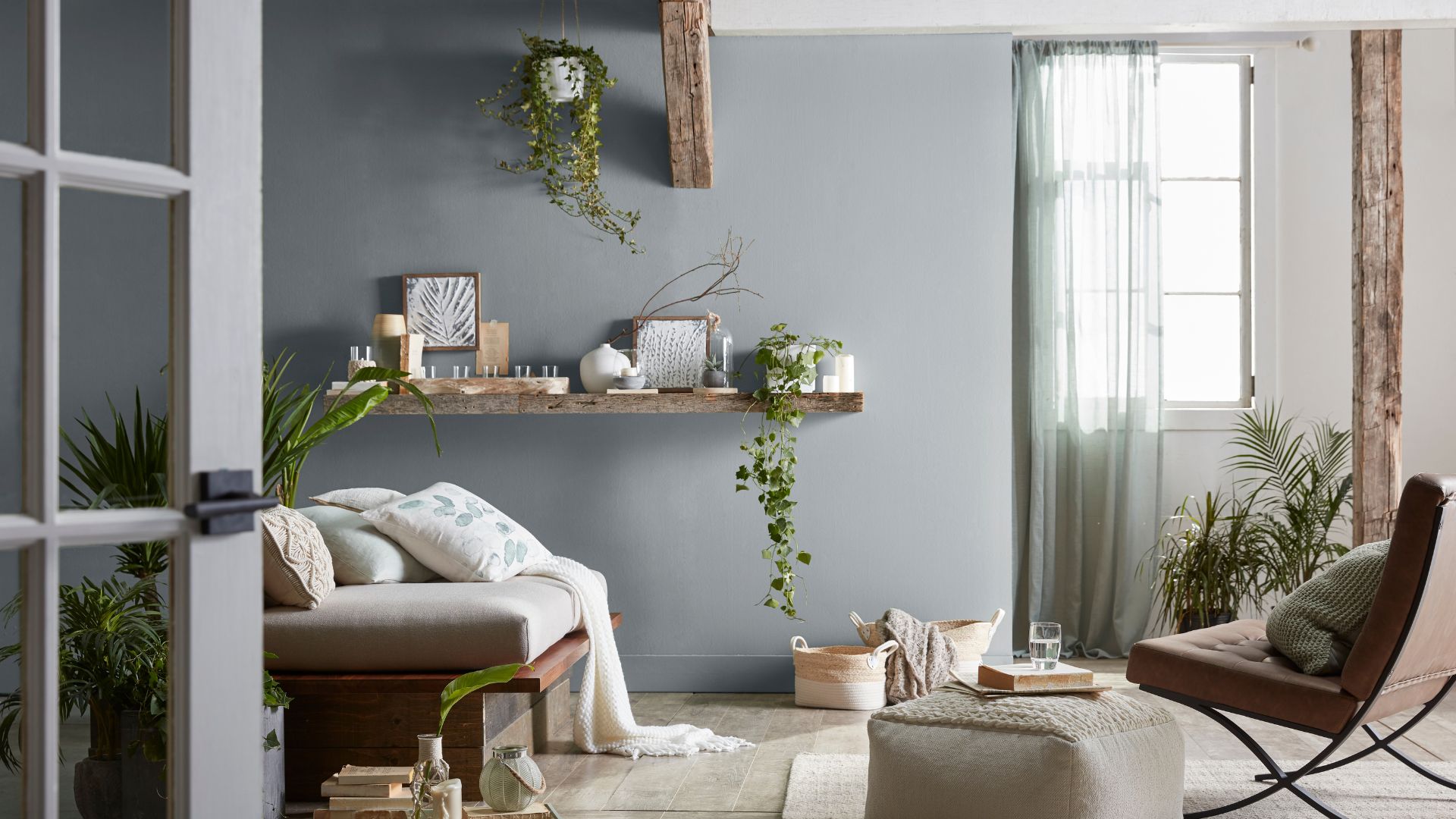 Grey themed living room decorated with plants and wooden decor