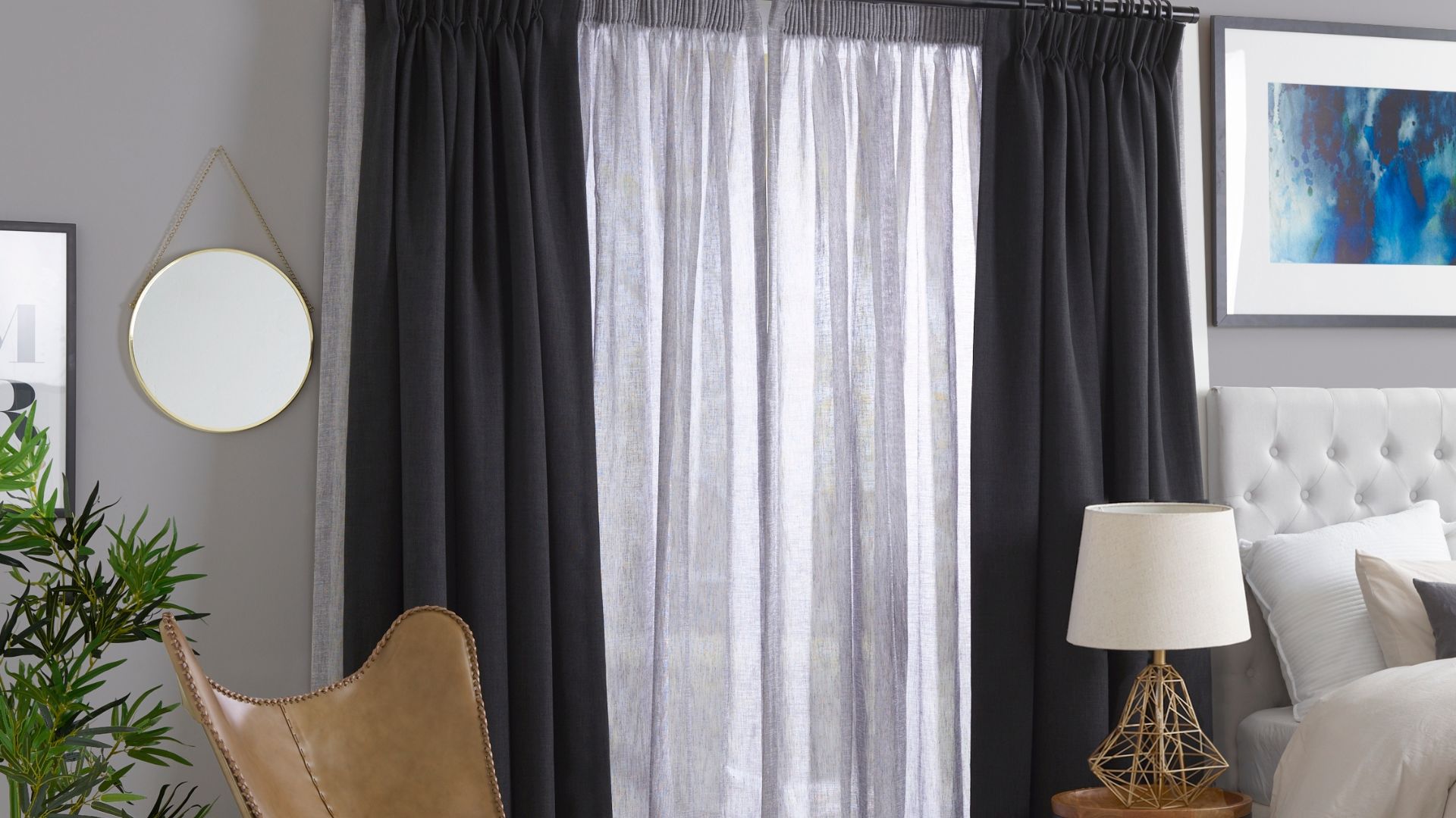 Sheer curtains layered with block out black curtains