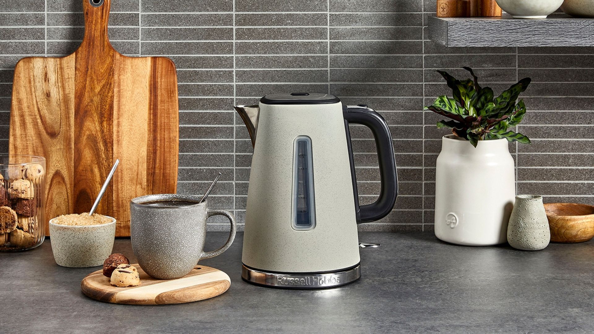Preparing Tea With A Stone Grey Electric Kettle
