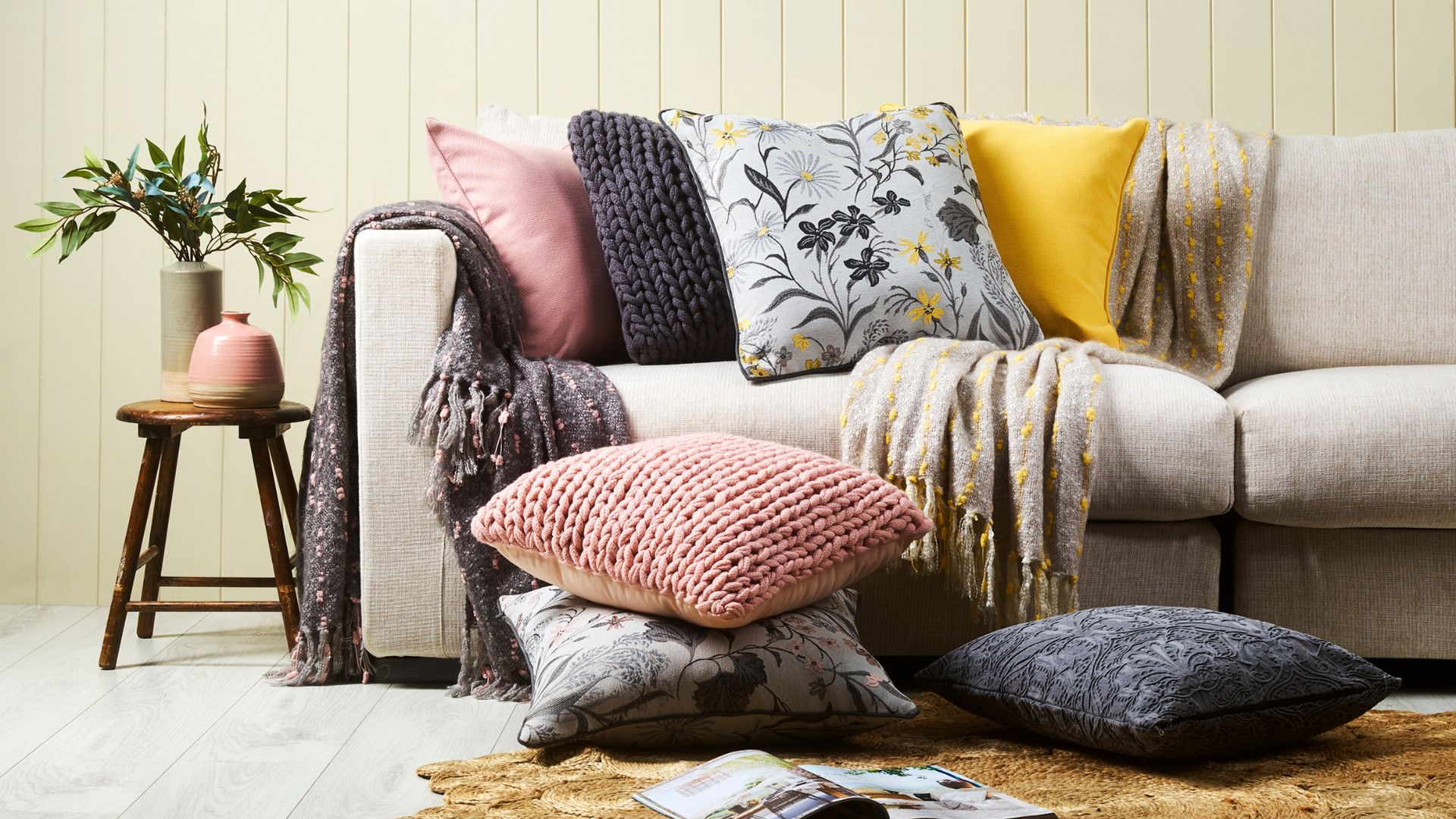Chunky knit cushion paired with printed floral cushions