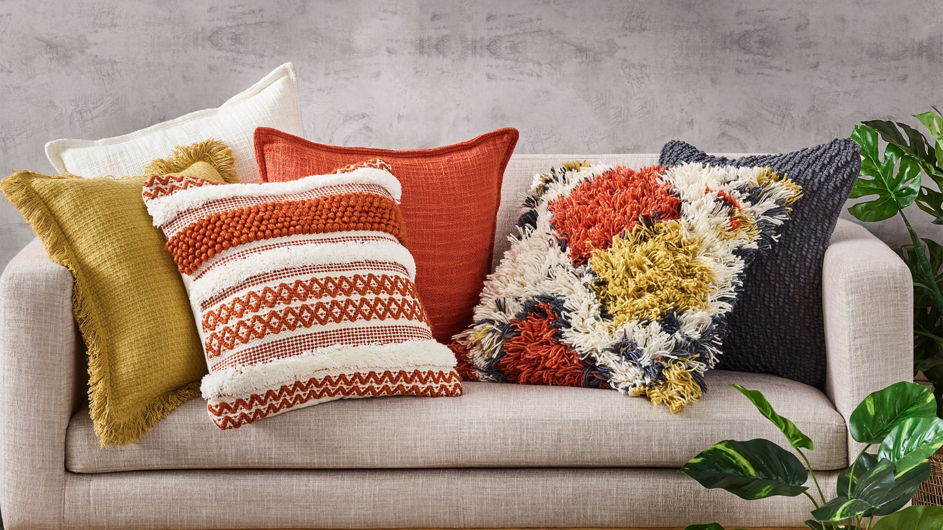 Tufted textured cushions paired with fringe cushions