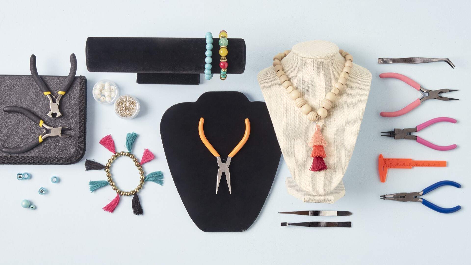 Assorted jewellery plier tools, tweezers, beads and ruler