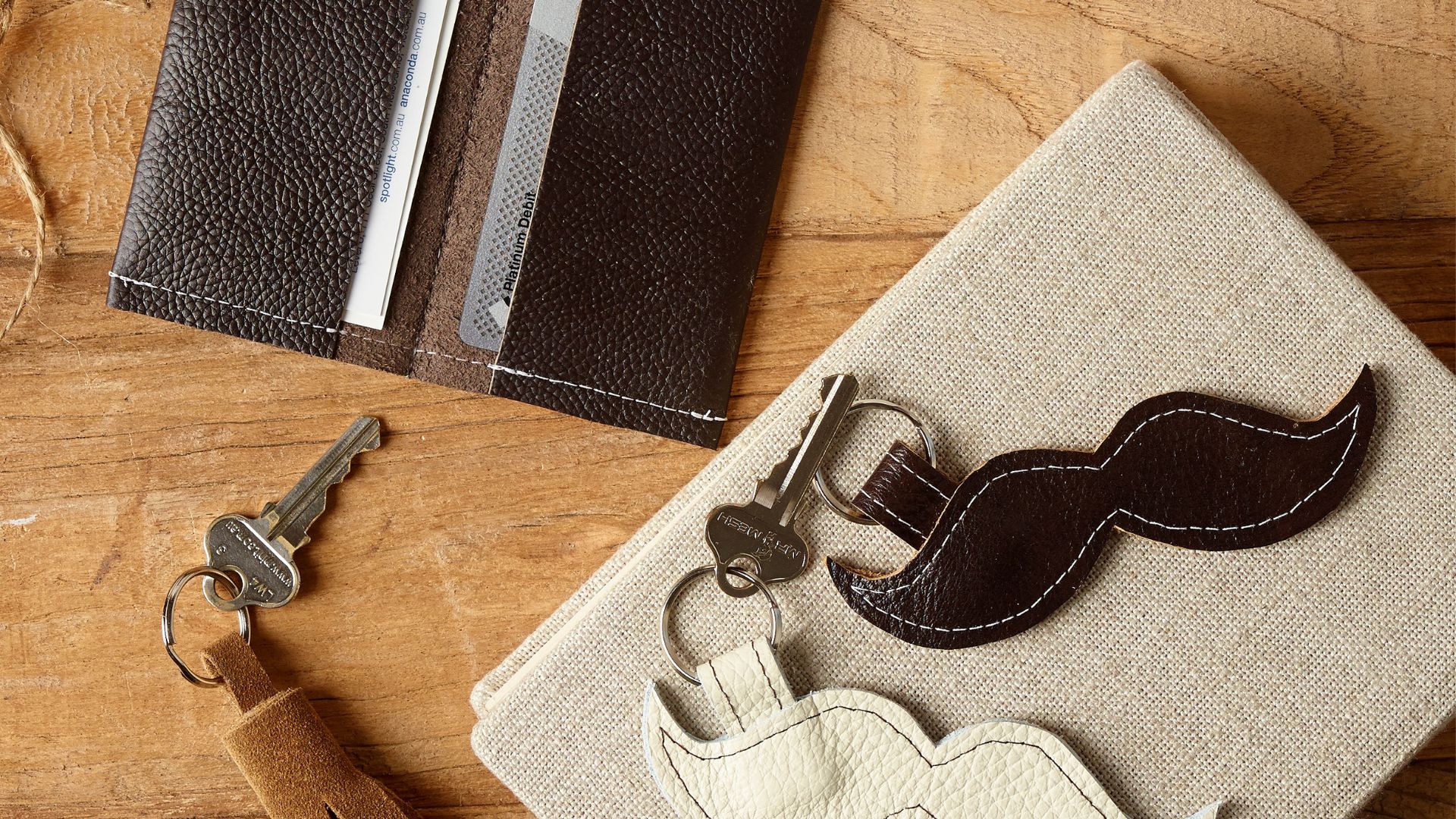 Folded faux leather card case and faux leather moustache keyring