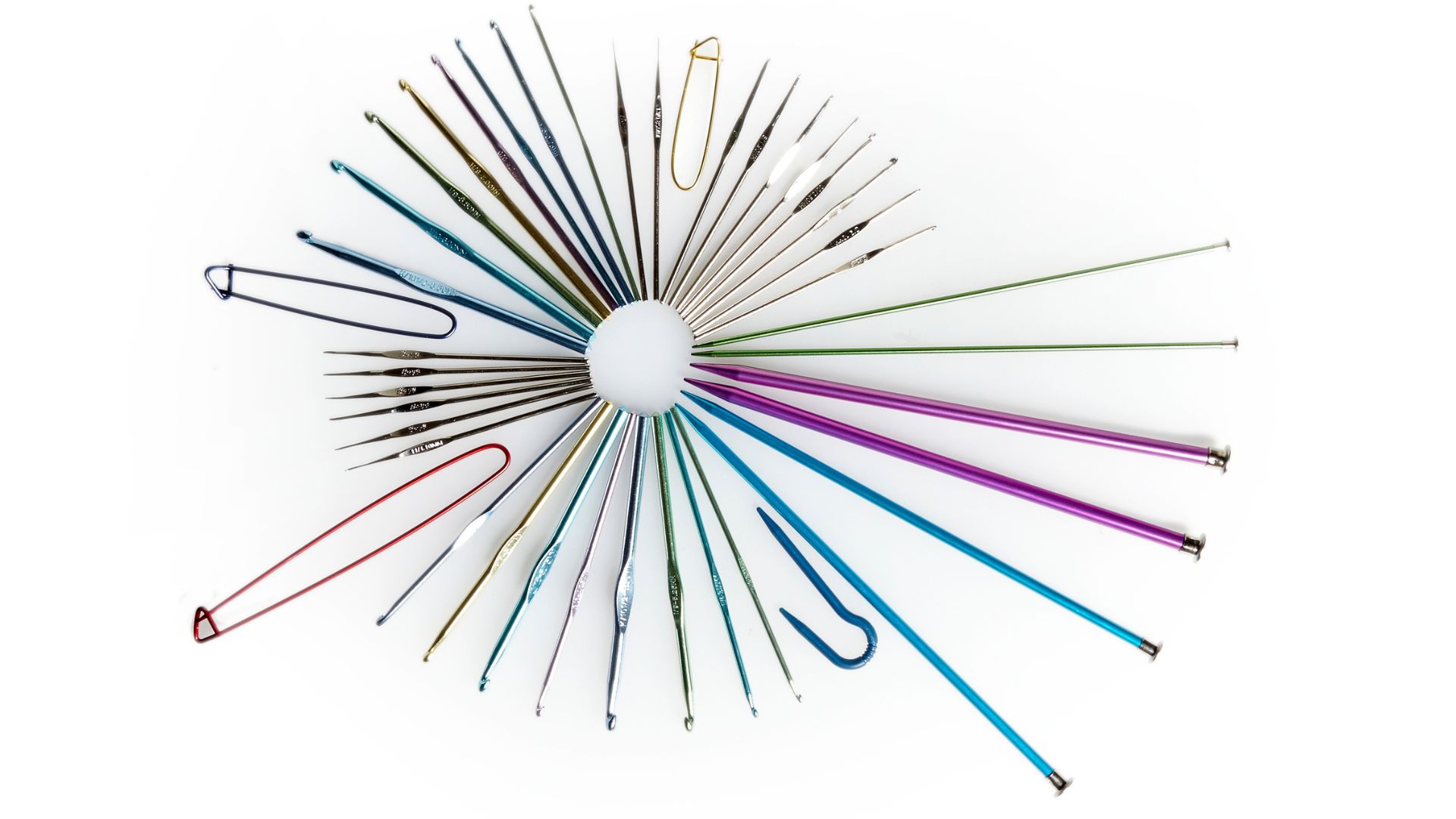Knitting needles, crochet hooks & cable holders arranged in a mandela