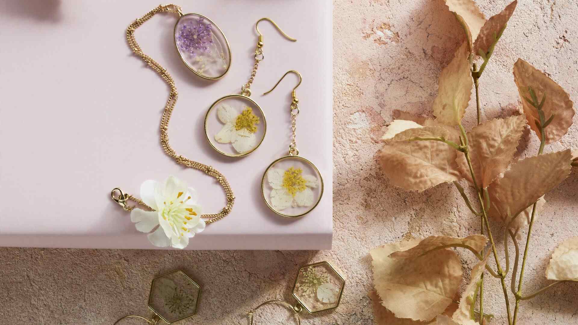 Clear resin cast pressed dried flower earrings and pendants