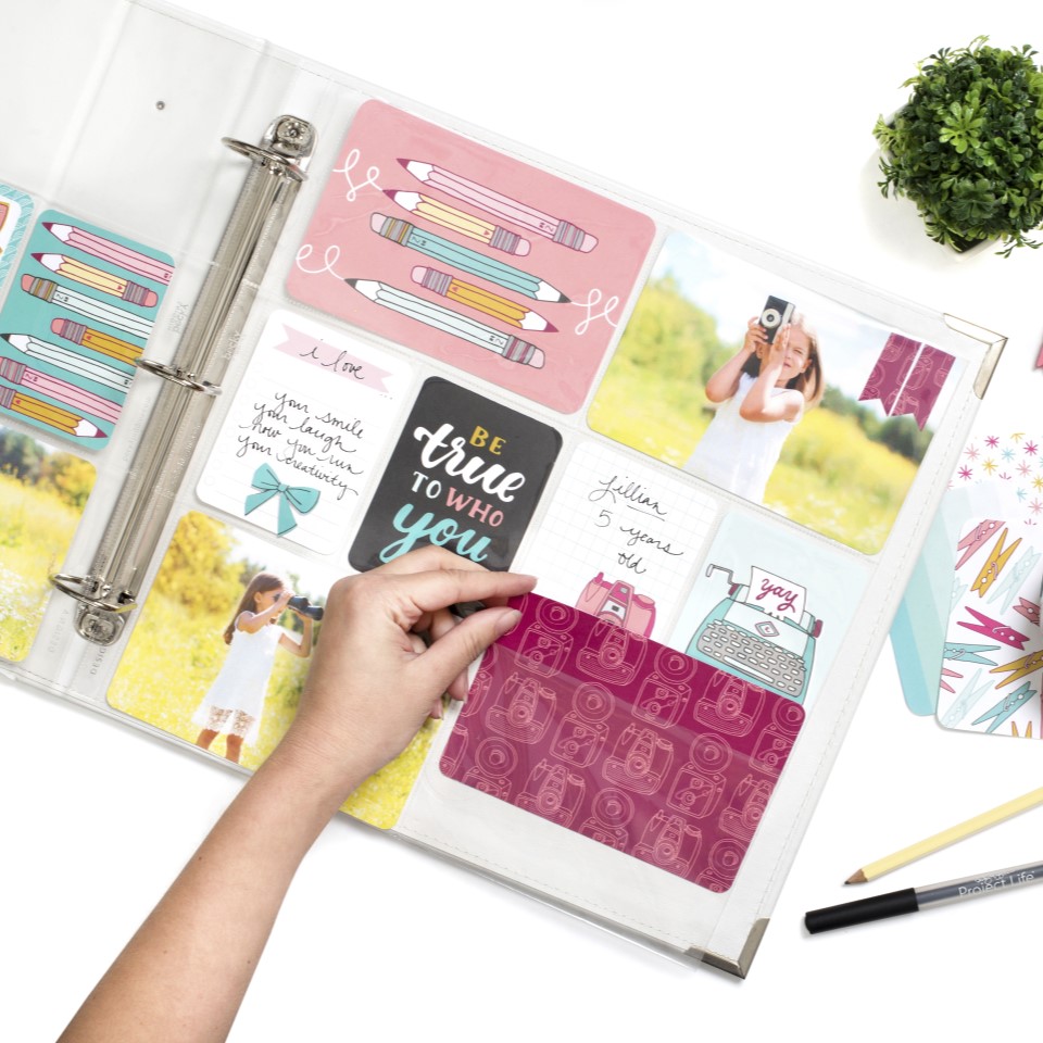 Binder scrapbook layout with clear file inserts
